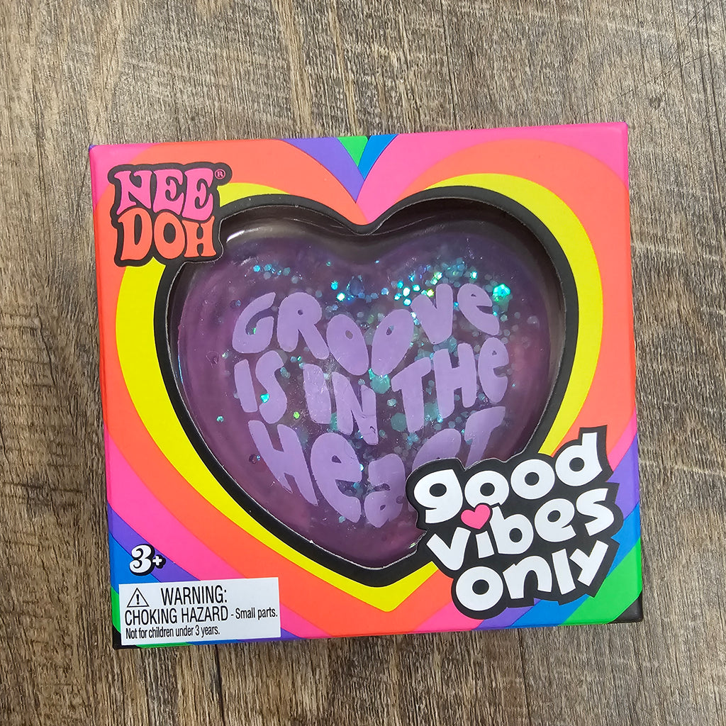 Groovy Heart purple squishy toy in retail packaging